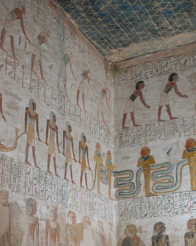 White painted stone walls with figures in the tomb of Merenebetah