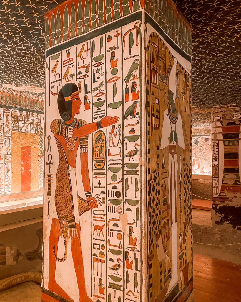 Intricately painted colourful walls covered in hieroglyphs and figures in the tomb of Nefertari