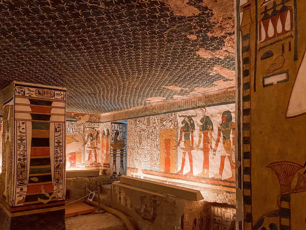 Intricately painted colourful walls covered in hieroglyphs and figures in the tomb of Nefertari