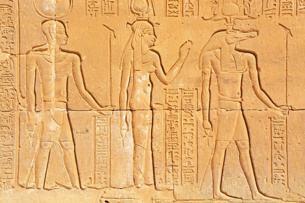 Carving of figures on the wall of Kom Ombu Temple