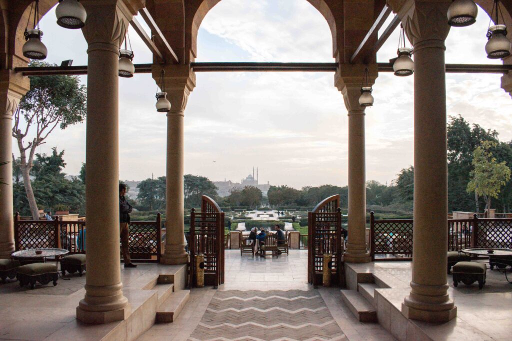 Minarets of mosques seen through the columns of The Citadel Restaurant in Al Azhar Park, Cairo