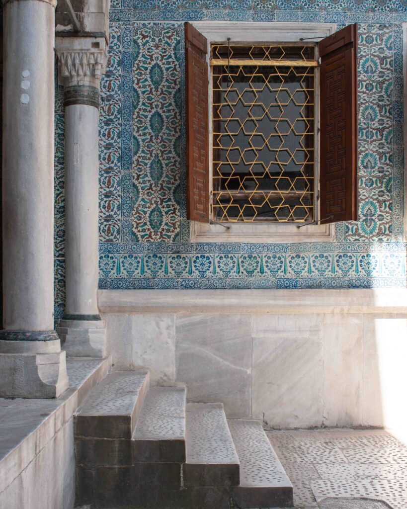 Geometric tiled wall with shuttered window in Topkapi Palace