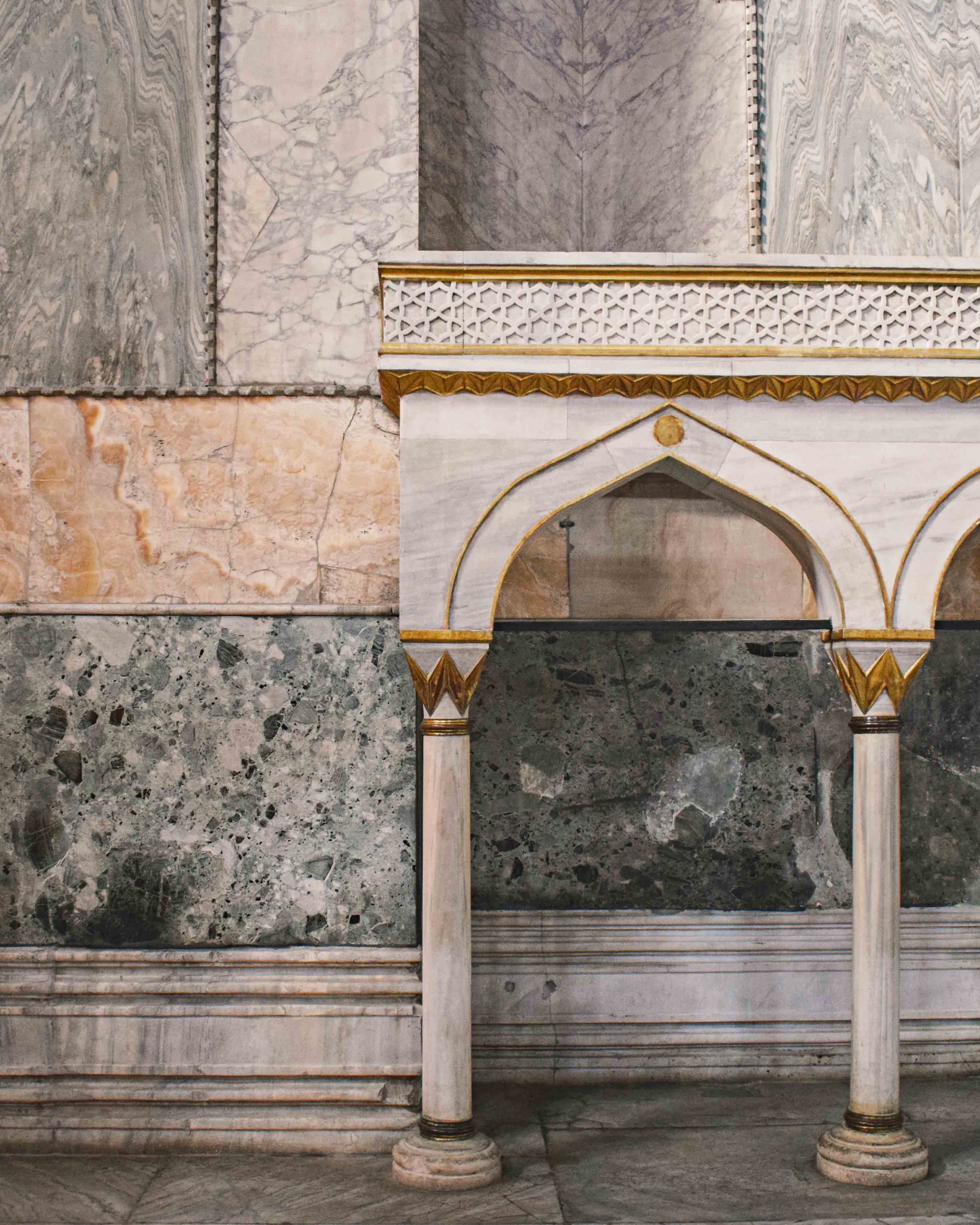 White and gold Islamic design arches inside Hagia Sophia